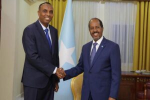 Somalia's President Hassan Sheikh Mohamud poses for a photograph with newly appointed Prime Minister Hamza Abdi Barre at the Presidential Palace in Mogadishu, Somalia, June 15, 2022 (Photo: Presidential Press Service/Handout via Reuters)