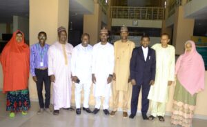 The two teams in a group photograph at the end of the meeting (Photo: Zayyanu Shehu)