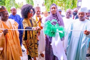 Minister Sadiya cutting the tape to commemorate the first anniversary of the National Senior Citizens Centre in Abuja. On her right is the director of the centre, Dr. Emem Omokaro