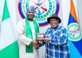 Surveyors body confers prestigious fellowship on Defence Minister